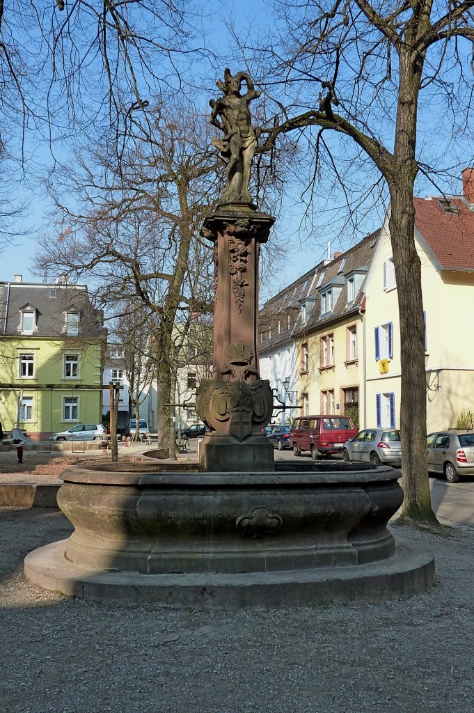 Freiburg im Breisgau, der Sebastiansbrunnen, stand frher in der Altstadt, seit 1878 auf dem Annaplatz im Stadtteil Wiehre, Mrz 2012