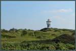 Die Dnenlandschaft mit dem Wahrzeichen der Insel Langeoog - dem 1909 errichteten Wasserturm.