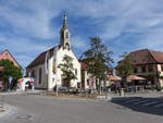 Volkach, evangelische Michaelskapelle am oberen Markt, Saalbau mit eingezogenem Polygonchor und Dachreiter, erbaut Anfang der 15.