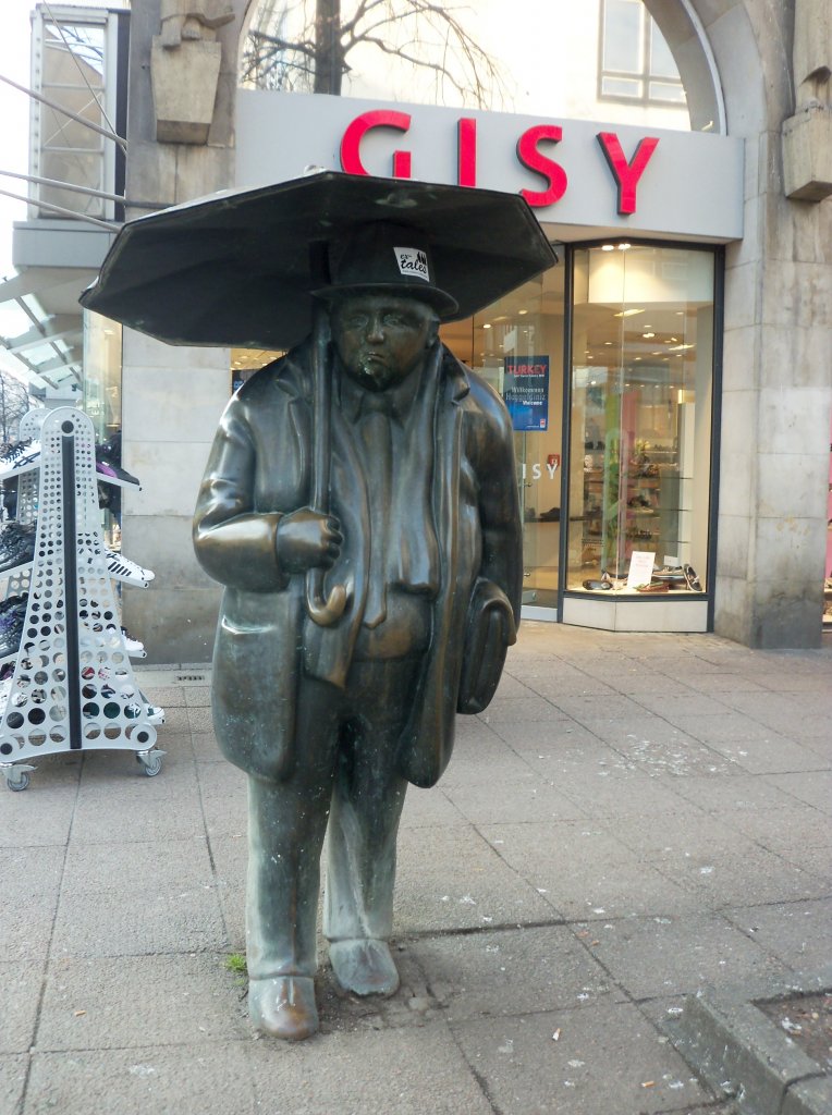 Man mit Regenschirm in Hannover. Foto vom 01.03.2011