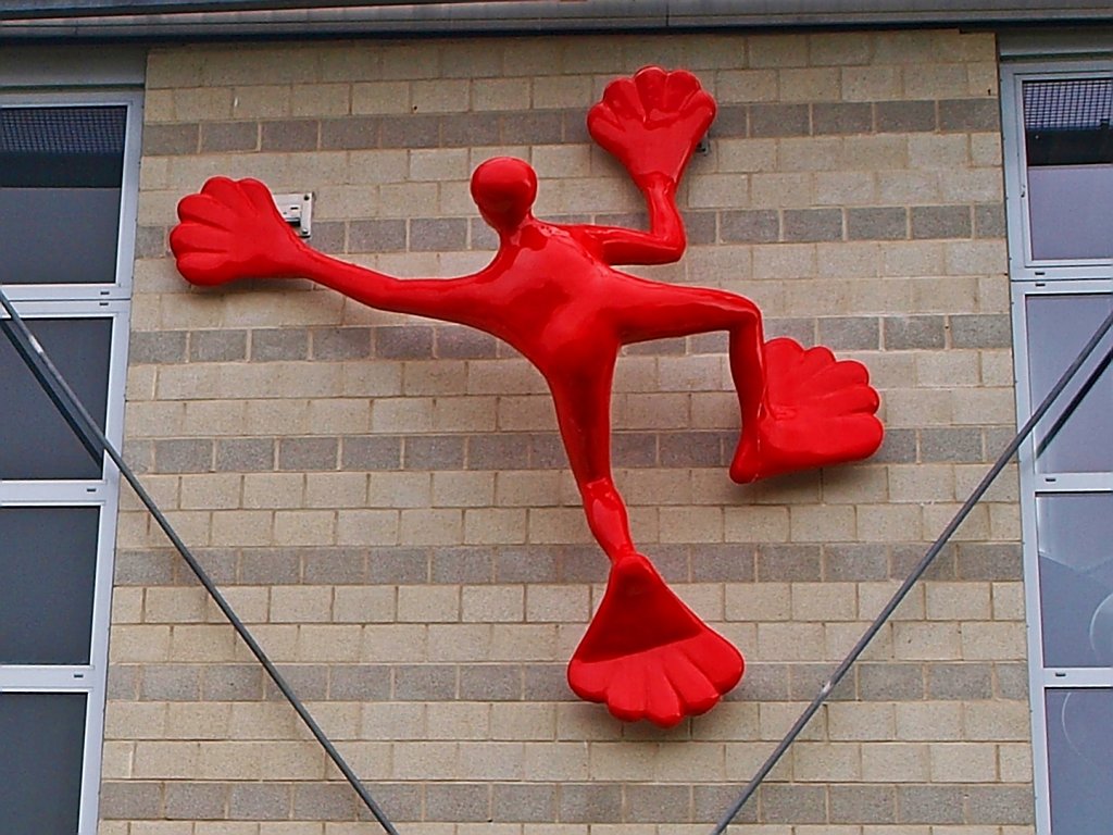 Roter Flossi auf dem Weg nach oben. Dieser poppige Kletterer der Objektknstlerin Rosalie erklimmt das Institut fr Kunststoffverarbeitung (IKV) an der RWTH Aachen am Seffenter Weg. Die Figur ist von 2005, aus Glasfaserverstrktem Kunststoff, mit Acryl Lackiert und ca. 3,2 mal 2,0 Meter gro. Die Knstlerin Rosalie ist unter anderem auch Malerin, Bhnenbildnerin und Professorin fr Gestaltung an der Hochschule Offenbach.