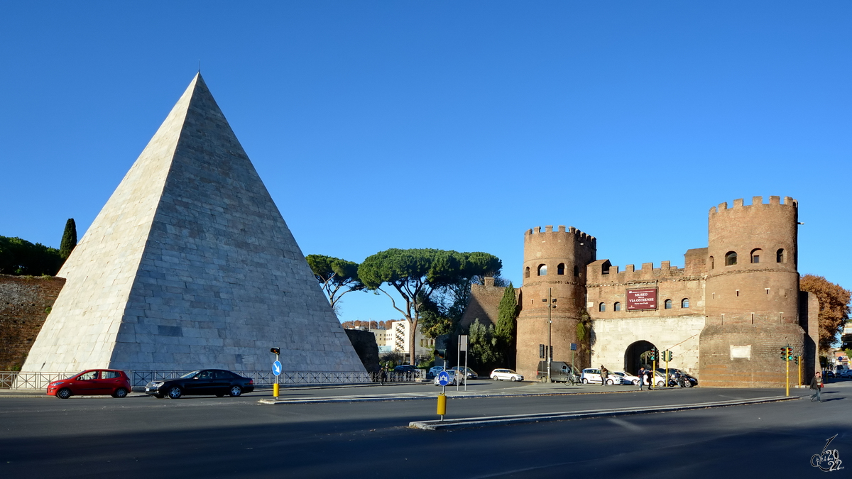 Das Porta San Paolo ist ein Stadttor der Aurelianischen Mauer in Rom. Davor zu sehen die Cestius-Pyramide (Piramide di Caio Cestio), dem Grabmal des rmischen Prtors und Volkstribuns Gaius Cestius Epulo († vor 12 v. Chr.). (Dezember 2015)