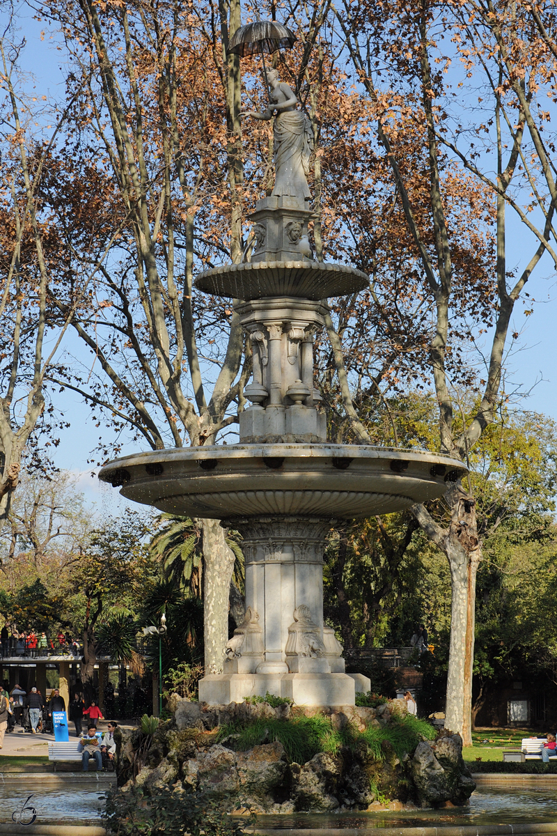 Die Dame mit dem Schirm im Parc de la Ciutadella. (Barcelona, Dezember 2011)