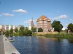 Hansestadt Demmin,  Blick vom Peenehafen auf die fast 100m hohe  Backsteinkirche und den umgebauten Speicher,  2006