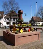 Gundelfingen, Brunnen mit Osterschmuck im Ortszentrum, April 2015