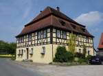 Hornau, Gasthof zum goldenen Hirschen, Mansardwalmdachbau in Fachwerk ber massivem Erdgeschoss, 18.