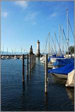 Blick vom Hafen auf den Bayrischen Lwen und den neuen Leuchturm,Jahrgang 1856,  von Lindau.