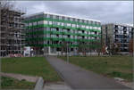 Moderne Architektur in Basel -    Grn gestreift: Genossenschaftshaus der Architekten Buchner Brndler auf dem ehemaligen Gterbahnhofsgelnde in Basel-Rosental.