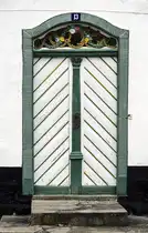 Eingangst�r an der Storegade in Augustenburg auf der Insel Alsen (Nordschleswig). Aufnahme: 20. M�rz 2024.