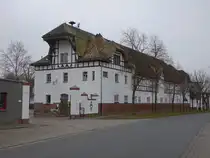 Plau�ig, Geb�ude der Firma Saat-Gut Plau�ig Voges KG in der Dorfstra�e (14.12.2024)