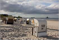 Heringsdorf. Abendliche Stimmung am Strand mit Strandkrben und Seebrcke. 06.05.2019