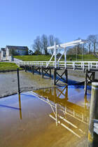 Tnning (Nordfriesland). Brcke am Tnner Innerhafen bei Niedrigwasser. Aufnahme: 31. Mrz 2020.