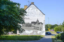 Fassade mit einem historischen Foto von Koszalin (Kslin) in Hinterpommern. Aufnahme: 16. August 2020.