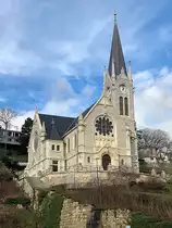 Biel/Bienne.
Franz�sische reformierte Kirche in Biel, frz: �glise du Pasquart � Bienne. 1902-04 von August Haag in sp�ter Neuromanik nach Pl�nen von Armin St�cklin. Auf Hangterrasse kreuzf�rmige Emporenkirche mit seitlichem Glockenturm.
Aufnahme vom 25. Dez. 2020